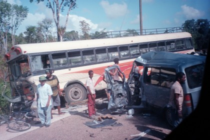 crash between a Ford Aerostar and a bus